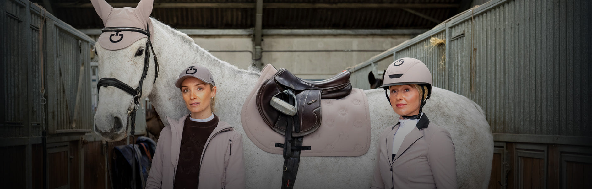 Two Women Stood With A Grey Horse, All Wearing Clothing From The Cavalleria Toscana Winter Collection